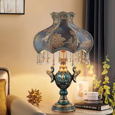 Ornate blue and gold antique table lamp with a beaded floral fabric shade